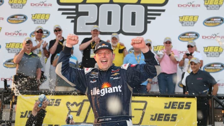 DOVER, DE - MAY 04: Johnny Sauter, driver of the #21 Allegiant Airlines Chevrolet, celebrates in victory lane after winning the NASCAR Camping World Truck Series JEGS 200 at Dover International Speedway on May 4, 2018 in Dover, Delaware. (Photo by Brian Lawdermilk/Getty Images)