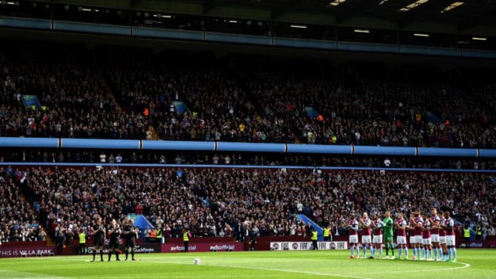 BIRMINGHAM, ENGLAND - APRIL 23: Players stand at the minute of applaud for Ugo Ehiogu prior to the Sky Bet Championship match between Aston Villa and Birmingham City at Villa Park on April 23, 2017 in Birmingham, England. (Photo by Ross Kinnaird/Getty Images)