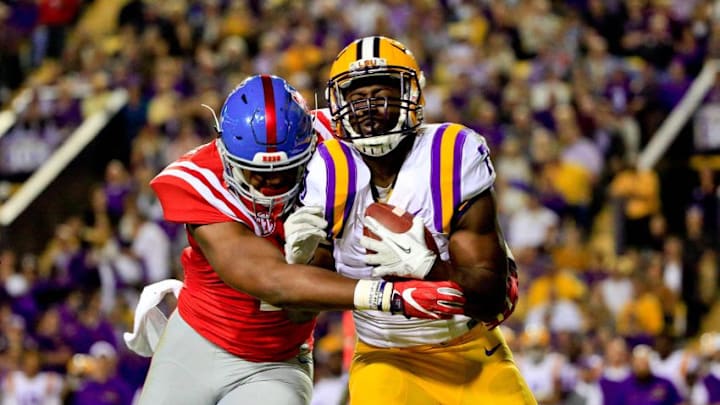 Oct 22, 2016; Baton Rouge, LA, USA; Mississippi Rebels linebacker Detric Bing-Dukes (43) tackles LSU Tigers running back Leonard Fournette (7) during the first half of a game at Tiger Stadium. Mandatory Credit: Derick E. Hingle-USA TODAY Sports