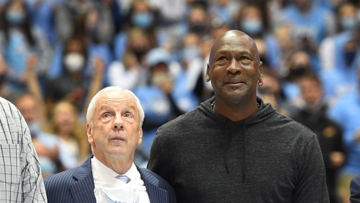 Jan 29, 2022; Chapel Hill, North Carolina, USA; Former North Carolina Tar Heels head coach Roy Williams with former UNC great Michael Jordan on the court as they were honored as part of the 1982 national championship team in the second half at Dean E. Smith Center. Mandatory Credit: Bob Donnan-USA TODAY Sports