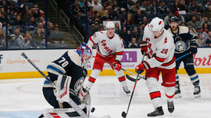 Oct 24, 2019; Columbus, OH, USA; Columbus Blue Jackets goalie Joonas Korpisalo (70) makes a save against Carolina Hurricanes center Sebastian Aho (20) during the third period at Nationwide Arena. Mandatory Credit: Russell LaBounty-USA TODAY Sports