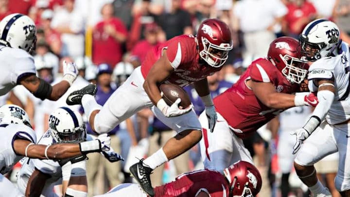 FAYETTEVILLE, AR - SEPTEMBER 9: Devwah Whaley #21 of the Arkansas Razorbacks leaps his own man during a game against the TCU Horned Frogs at Donald W. Reynolds Razorback Stadium on September 9, 2017 in Fayetteville, Arkansas. The Horn Frogs defeated the Razorbacks 28-7. (Photo by Wesley Hitt/Getty Images)