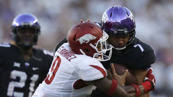FORT WORTH, TX - SEPTEMBER 10: Kenny Hill #7 of the TCU Horned Frogs runs against Santos Ramirez #9 of the Arkansas Razorbacks in the first half at Amon G. Carter Stadium on September 10, 2016 in Fort Worth, Texas. (Photo by Ronald Martinez/Getty Images)