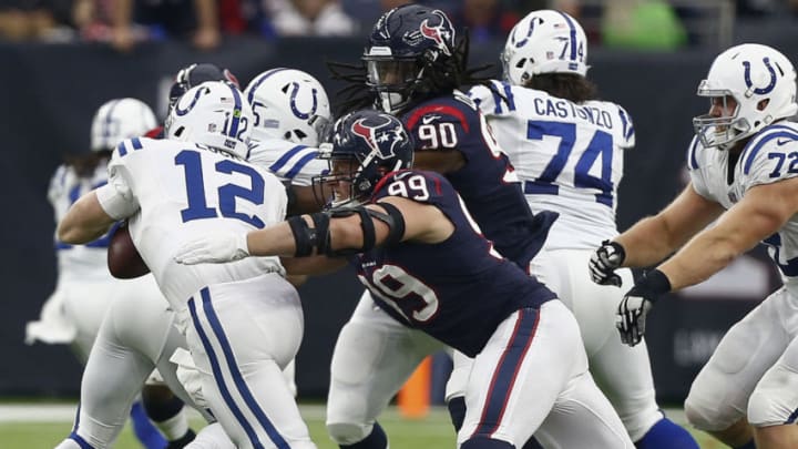 HOUSTON, TX - DECEMBER 09: Andrew Luck #12 of the Indianapolis Colts is sacked by J.J. Watt #99 of the Houston Texans during the third quarter at NRG Stadium on December 9, 2018 in Houston, Texas. (Photo by Bob Levey/Getty Images)