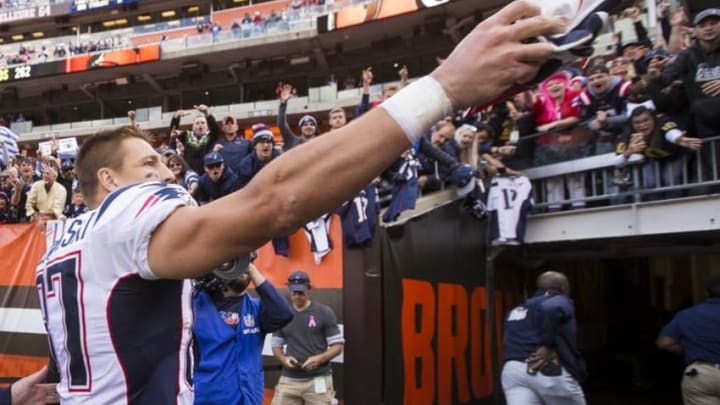 Oct 9, 2016; Cleveland, OH, USA; New England Patriots tight end Rob Gronkowski (87) gives his glove to a fan after the game against the Cleveland Browns at FirstEnergy Stadium. The Patriots won 33-13. Mandatory Credit: Scott R. Galvin-USA TODAY Sports