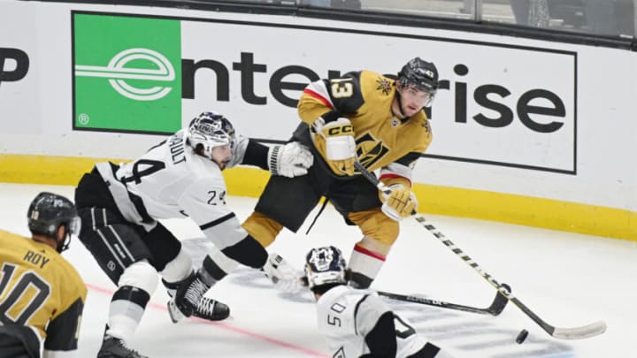 Oct 11, 2022; Los Angeles, California, USA; Vegas Golden Knights center Paul Cotter (43) plays the puck defended by Los Angeles Kings center Phillip Danault (24) in the third period at Crypto.com Arena. Mandatory Credit: Richard Mackson-USA TODAY Sports