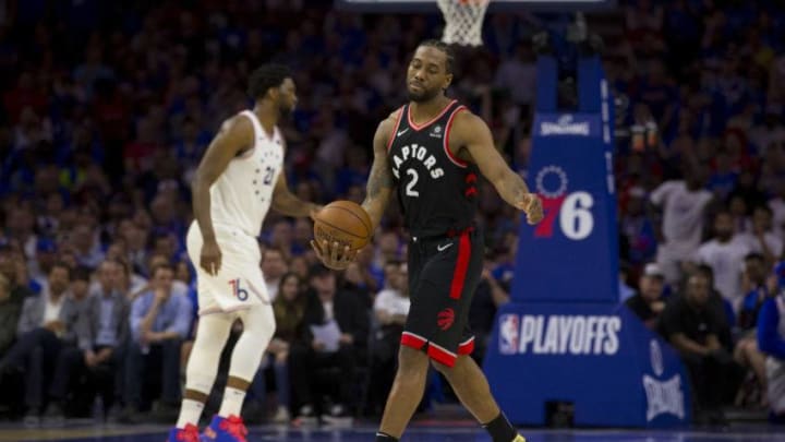 Kawhi Leonard #2 of the Toronto Raptors reacts in front of Joel Embiid #21 of the Philadelphia 76ers in the second quarter of Game Three of the Eastern Conference Semifinals. (Photo by Mitchell Leff/Getty Images)