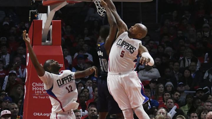 Dec 23, 2016; Los Angeles, CA, USA; LA Clippers center Marreese Speights (5) and forward Luc Mbah a Moute (12) defend against Dallas Mavericks forward Harrison Barnes (40) in the second half of the NBA basketball game at Staples Center. Mandatory Credit: Richard Mackson-USA TODAY Sports