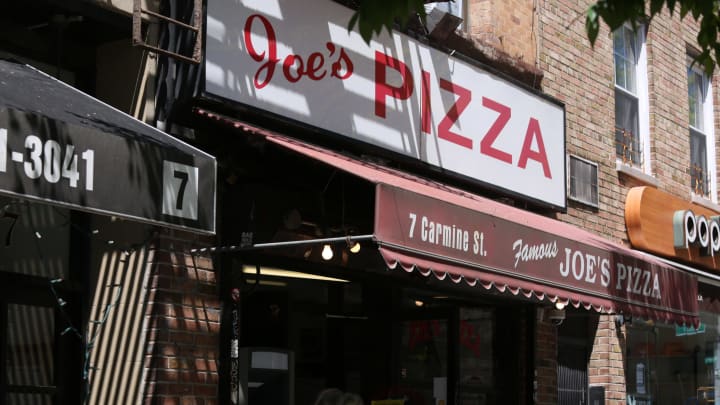 NEW YORK, NEW YORK – MAY 12: A view of Joe’s Pizza on May 12, 2020 in New York City. COVID-19 has spread to most countries around the world, claiming over 291,000 lives with infections of over 4.3 million people. (Photo by Rob Kim/Getty Images)