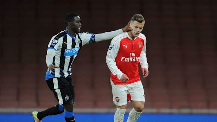 LONDON, ENGLAND - APRIL 08: Jack Wilshere of Arsenal pushed in the face by Newcastle's Henri Saivet during the Barclays Premier League match between Arsenal and Newcastle United at Emirates Stadium on April 8, 2016 in London, England. (Photo by Stuart MacFarlane/Arsenal FC via Getty Images)