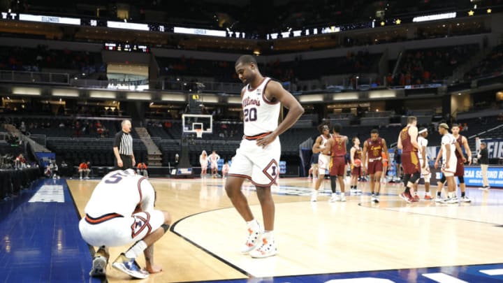 INDIANAPOLIS, INDIANA - MARCH 21: Andre Curbelo #5 and Da'Monte Williams #20 of the Illinois Fighting Illini react in the final moments of the second half against the Loyola Chicago Ramblers in the second round game of the 2021 NCAA Men's Basketball Tournament at Bankers Life Fieldhouse on March 21, 2021 in Indianapolis, Indiana. (Photo by Sarah Stier/Getty Images)