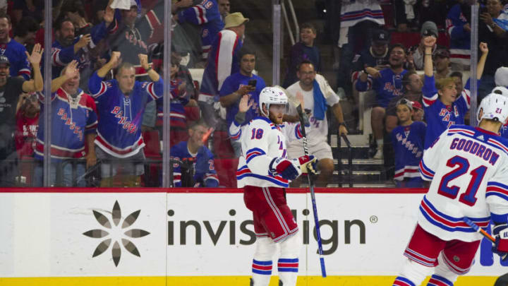 May 30, 2022; Raleigh, North Carolina, USA; New York Rangers center Andrew Copp (18) celebrates his empty net goal against the Carolina Hurricanes during the third period in game seven of the second round of the 2022 Stanley Cup Playoffs at PNC Arena. Mandatory Credit: James Guillory-USA TODAY Sports
