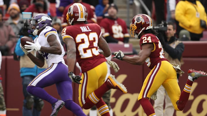 LANDOVER, MD - NOVEMBER 12: Wide receiver Stefon Diggs #14 of the Minnesota Vikings makes a catch past free safety DeAngelo Hall #23 of the Washington Redskins during the first quarter at FedExField on November 12, 2017 in Landover, Maryland. (Photo by Patrick Smith/Getty Images)