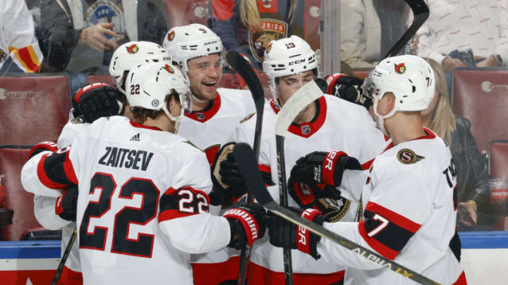 SUNRISE, FL - DECEMBER 14: Josh Norris #9 of the Ottawa Senators celebrates his third period goal with teammates against the Florida Panthers at the FLA Live Arena on December 14, 2021 in Sunrise, Florida. (Photo by Joel Auerbach/Getty Images)