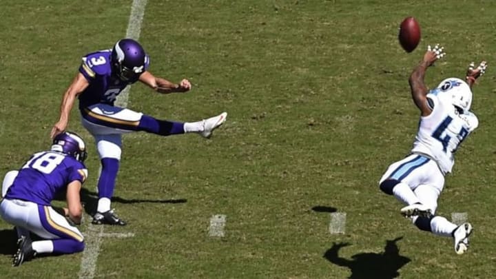 Sep 11, 2016; Nashville, TN, USA; Minnesota Vikings kicker Blair Walsh (3) kicks the ball as Tennessee Titans defensive back Valentino Blake (47) defends at Nissan Stadium. Mandatory Credit: Andrew Nelles/The Tennessean-USA TODAY Sports