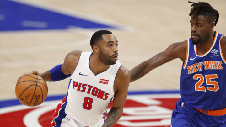 Dec 13, 2020; Detroit, Michigan, USA; Detroit Pistons guard Wayne Ellington (8) gets defended by New York Knicks forward Reggie Bullock (25) during the fourth quarter at Little Caesars Arena. Mandatory Credit: Raj Mehta-USA TODAY Sports