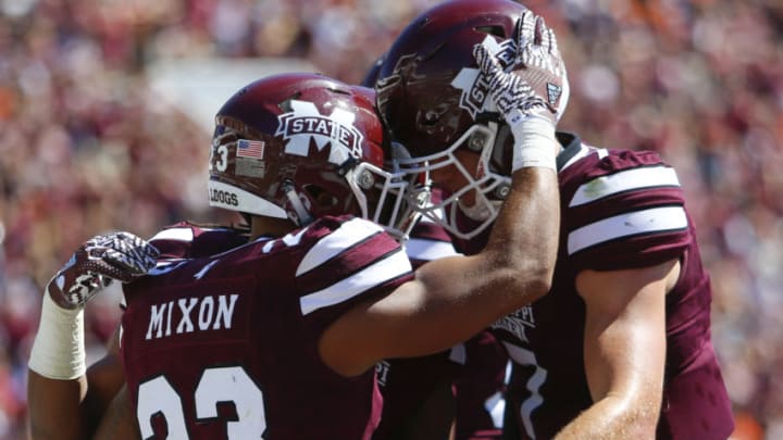 STARKVILLE, MS - OCTOBER 8: Wide receiver Keith Mixon #23 of the Mississippi State Bulldogs celebrates with quarterback Nick Fitzgerald #7 after he scores a touchdown against the Auburn Tigers during the second half of an NCAA college football game on Oct. 8, 2016 in Starkville, Mississippi. (Photo by Butch Dill/Getty Images)