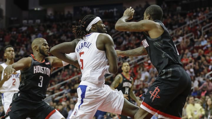 HOUSTON, TX – OCTOBER 26: Montrezl Harrell #5 of the Los Angeles Clippers drives to the basket defended by Chris Paul #3 of the Houston Rockets and Gary Clark #6 in the second half at Toyota Center on October 26, 2018 in Houston, Texas. NOTE TO USER: User expressly acknowledges and agrees that, by downloading and or using this Photograph, user is consenting to the terms and conditions of the Getty Images License Agreement. (Photo by Tim Warner/Getty Images)