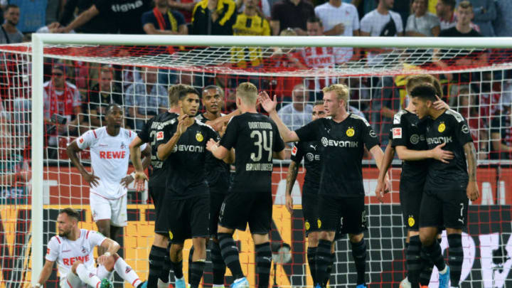 Dortmund's players celebrate after Spanish forward Paco Alcacer scoried the 1-3 goal during the German first division Bundesliga football match 1 FC Cologne v BVB Borussia Dortmund in Cologne, western Germany on August 23, 2019. (Photo by UWE KRAFT / AFP) / RESTRICTIONS: DFL REGULATIONS PROHIBIT ANY USE OF PHOTOGRAPHS AS IMAGE SEQUENCES AND/OR QUASI-VIDEO (Photo credit should read UWE KRAFT/AFP/Getty Images)