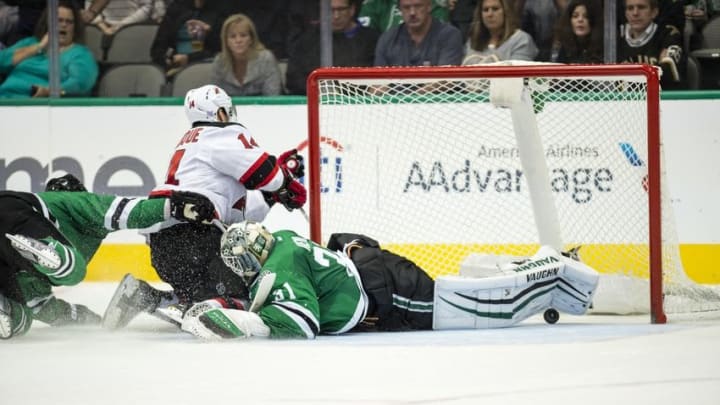 Nov 15, 2016; Dallas, TX, USA; New Jersey Devils center Adam Henrique (14) scores the game winning goal against Dallas Stars goalie Antti Niemi (31) during the overtime period at the American Airlines Center. The Devils defeated the Stars 2-1 in overtime. Mandatory Credit: Jerome Miron-USA TODAY Sports