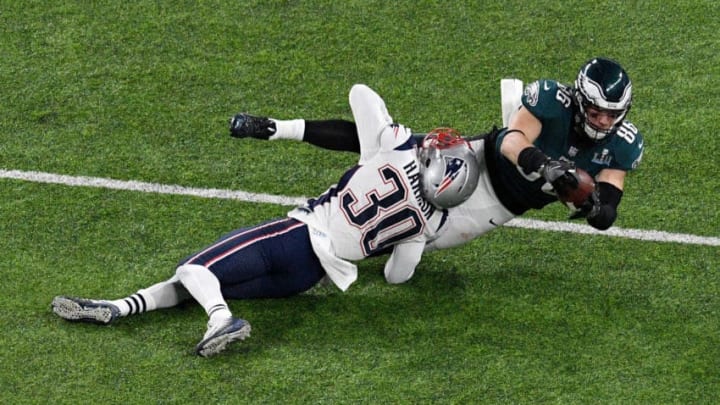 MINNEAPOLIS, MN - FEBRUARY 04: Zach Ertz #86 of the Philadelphia Eagles makes a catch as he is tackled by Duron Harmon #30 of the New England Patriots during the fourth quarter in Super Bowl LII at U.S. Bank Stadium on February 4, 2018 in Minneapolis, Minnesota. (Photo by Hannah Foslien/Getty Images)