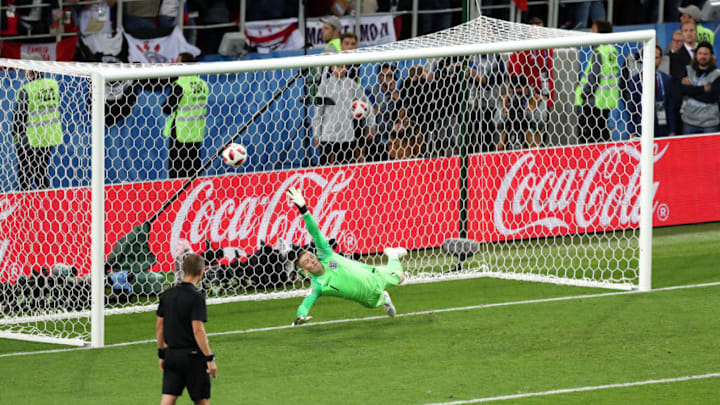 MOSCOW, RUSSIA - JULY 03: Jordan Pickford of England fails to save Juan Cuadrado of Colombia (not pictured) penalty during the 2018 FIFA World Cup Russia Round of 16 match between Colombia and England at Spartak Stadium on July 3, 2018 in Moscow, Russia. (Photo by Alex Morton/Getty Images)