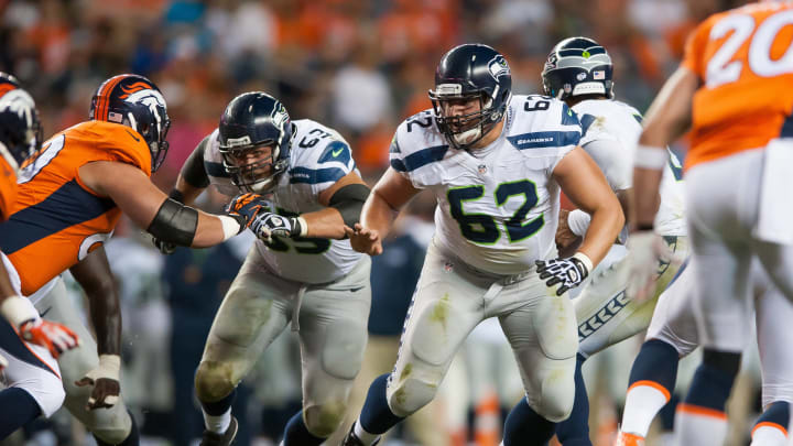 DENVER, CO – AUGUST 07: Guard Greg Van Roten #62 of the Seattle Seahawks blocks against the Denver Broncos during preseason action at Sports Authority Field at Mile High on August 7, 2014 in Denver, Colorado. (Photo by Dustin Bradford/Getty Images)