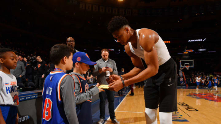NEW YORK, NY - APRIL 7: Giannis Antetokounmpo #34 of the Milwaukee Bucks signs autographs for fans before the game against the New York Knicks on April 7, 2018 at Madison Square Garden in New York City, New York. NOTE TO USER: User expressly acknowledges and agrees that, by downloading and or using this photograph, User is consenting to the terms and conditions of the Getty Images License Agreement. Mandatory Copyright Notice: Copyright 2018 NBAE (Photo by Jesse D. Garrabrant/NBAE via Getty Images)