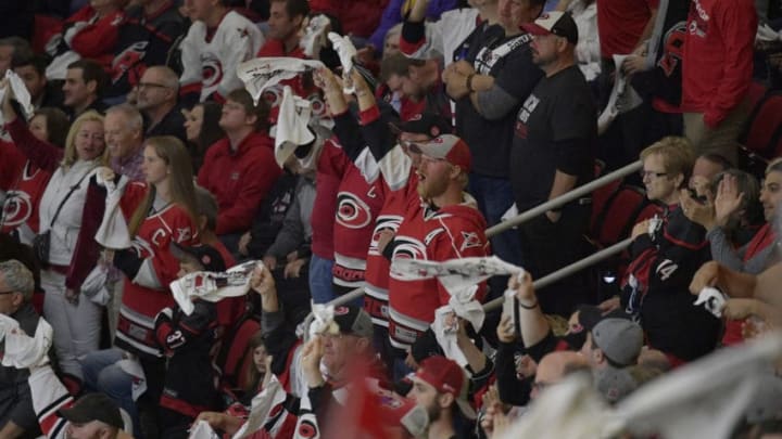 RALEIGH, NORTH CAROLINA - MAY 14: Carolina Hurricanes fans cheer during the third period in Game Three against the Boston Bruins in the Eastern Conference Finals during the 2019 NHL Stanley Cup Playoffs at PNC Arena on May 14, 2019 in Raleigh, North Carolina. (Photo by Grant Halverson/Getty Images)
