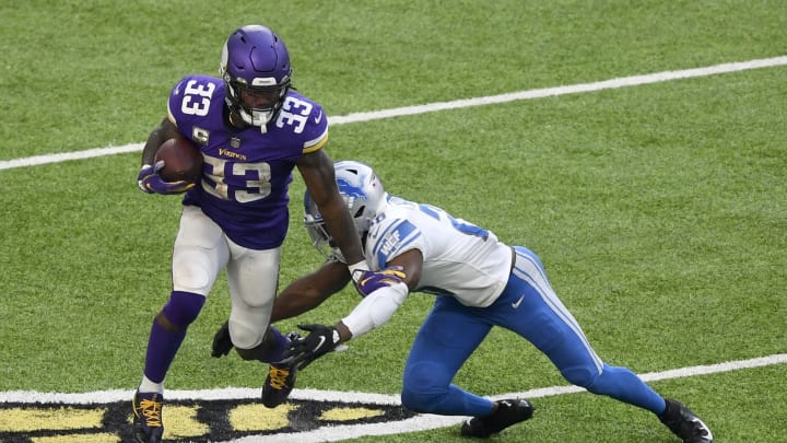 MINNEAPOLIS, MINNESOTA – NOVEMBER 08: Dalvin Cook #33 of the Minnesota Vikings is tackled by Duron Harmon #26 of the Detroit Lions at U.S. Bank Stadium on November 08, 2020 in Minneapolis, Minnesota. (Photo by Hannah Foslien/Getty Images)