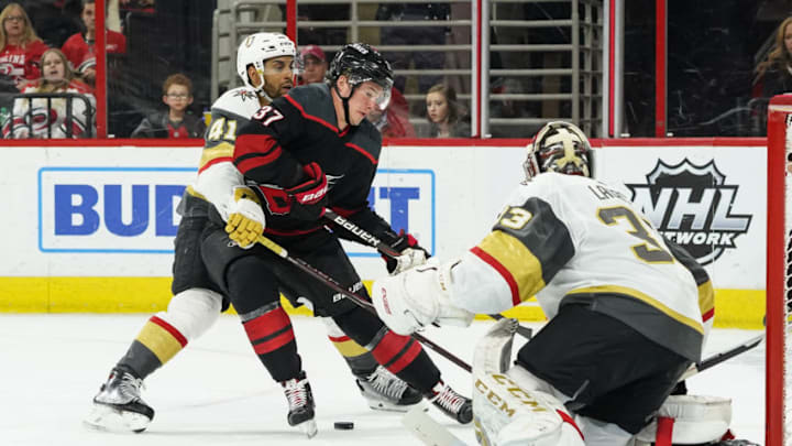 RALEIGH, NC - FEBRUARY 01: Vegas Golden Knights Center Pierre-Edouard Bellemare (41) defends against Carolina Hurricanes Left Wing Andrei Svechnikov (37) driving to the net during a game between the Las Vegas Golden Knights and the Carolina Hurricanes on February 1, 2019, at the PNC Arena in Raleigh, NC. (Photo by Greg Thompson/Icon Sportswire via Getty Images)