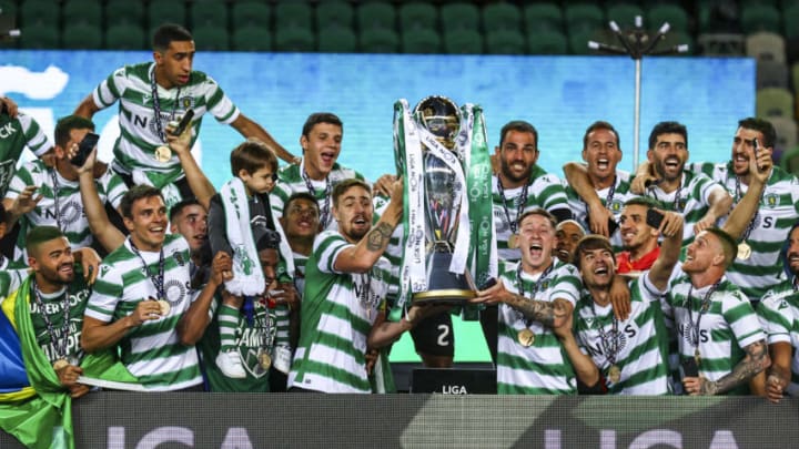 LISBON, PORTUGAL - MAY 11: Sporting CP players celebrate with the trophy wining the game and become Champions at the of the match of the Liga NOS match between Sporting CP and Boavista FC at Estadio Jose Alvalade on May 11, 2021 in Lisbon, Portugal. (Photo by Carlos Rodrigues/Getty Images)