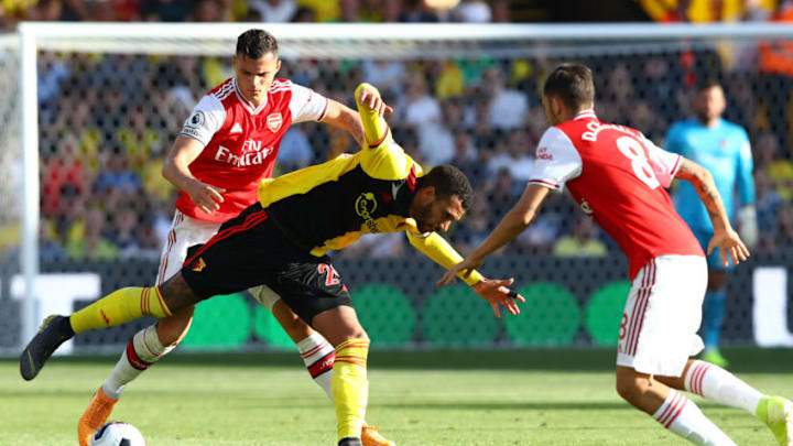WATFORD, ENGLAND - SEPTEMBER 15: Etienne Capoue of Watford battles with Granit Xhaka of Arsenal during the Premier League match between Watford FC and Arsenal FC at Vicarage Road on September 15, 2019 in Watford, United Kingdom. (Photo by Julian Finney/Getty Images)