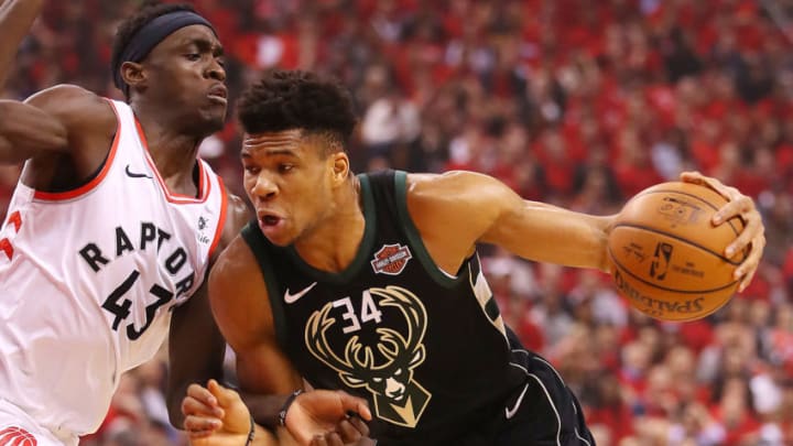 TORONTO, ONTARIO - MAY 25: Giannis Antetokounmpo #34 of the Milwaukee Bucks dribbles against Pascal Siakam #43 of the Toronto Raptors during the first half in game six of the NBA Eastern Conference Finals at Scotiabank Arena on May 25, 2019 in Toronto, Canada. NOTE TO USER: User expressly acknowledges and agrees that, by downloading and or using this photograph, User is consenting to the terms and conditions of the Getty Images License Agreement. (Photo by Gregory Shamus/Getty Images)