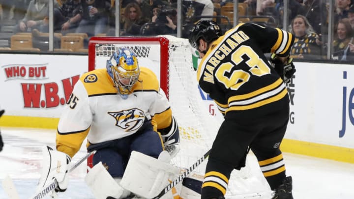 BOSTON, MA - DECEMBER 22: Boston Bruins left wing Brad Marchand (63) tries to jam the puck underneath Nashville Predators goalie Pekka Rinne (35) during a game between the Boston Bruins and the Nashville Predators on December 22, 2018, at TD Garden in Boston, Massachusetts. (Photo by Fred Kfoury III/Icon Sportswire via Getty Images)