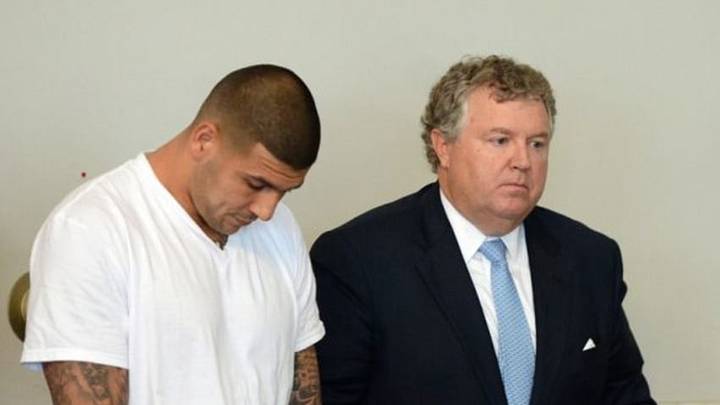 Jun 26, 2013; North Attleborough, MA, USA; New England Patriots former tight end Aaron Hernandez (left) stands with his attorney Michael Fee as he is arraigned in Attleboro District Court. Hernandez is charged with first degree murder in the death of Odin Lloyd. Mandatory Credit: The Sun Chronicle/Pool Photo via USA TODAY Sports Jun 26, 2013; North Attleborough, MA, USA; New England Patriots former tight end Aaron Hernandez (left) stands with his attorney Michael Fee as he is arraigned in Attleboro District Court. Hernandez is charged with first degree murder in the death of Odin Lloyd. Mandatory Credit: The Sun Chronicle/Pool Photo via USA TODAY Sports