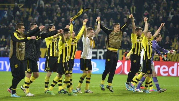 Dortmund's players celebrate winning the UEFA Champions League quarter-final second-leg football match Borussia Dortmund vs Malaga CF in Dortmund, western Germany on April 9, 2013. Dortmund won 3-2 and qualified for the semi-finals.AFP PHOTO / ODD ANDERSEN (Photo credit should read ODD ANDERSEN/AFP/Getty Images)