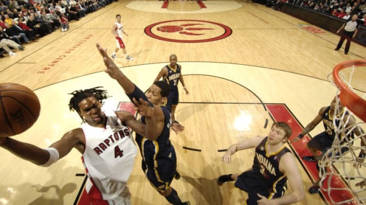 TORONTO - JANUARY 31: Chris Bosh #4 of the Toronto Raptors drives the paint and tries the hookshot over Danny Granger #33 of the Indiana Pacers during a game on January 31, 2010 at the Air Canada Centre in Toronto, Ontario, Canada. NOTE TO USER: User expressly acknowledges and agrees that, by downloading and or using this Photograph, user is consenting to the terms and conditions of the Getty Images License Agreement. Mandatory Copyright Notice: Copyright 2010 NBAE (Photo by Ron Turenne/NBAE via Getty Images)