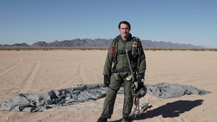 Tim Kennedy poses with his deployed parachute after a surviving an uncontrolled free-fall from 20,000 feet.