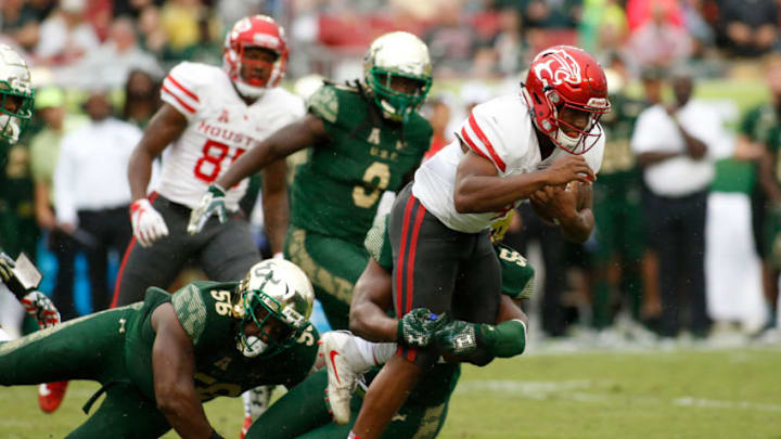 TAMPA, FL - OCTOBER 28: Quarterback D'Eriq King #4 of the Houston Cougars is sacked by defensive end Josh Black #55 of the South Florida Bulls during the first quarter of an NCAA football game on October 28, 2017 at Raymond James Stadium in Tampa, Florida. (Photo by Brian Blanco/Getty Images)