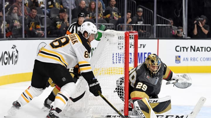 LAS VEGAS, NEVADA – OCTOBER 08: David Pastrnak #88 of the Boston Bruins tries a wraparound shot against Marc-Andre Fleury #29 of the Vegas Golden Knights in the third period of their game at T-Mobile Arena on October 8, 2019 in Las Vegas, Nevada. The Bruins defeated the Golden Knights 4-3. (Photo by Ethan Miller/Getty Images)