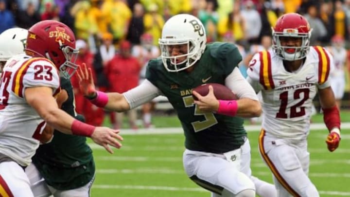 Oct 24, 2015; Waco, TX, USA; Baylor Bears quarterback Jarrett Stidham (3) stiff arms Iowa State Cyclones defensive back Darian Cotton (23) during a game at McLane Stadium. Baylor won 45-27. Mandatory Credit: Ray Carlin-USA TODAY Sports