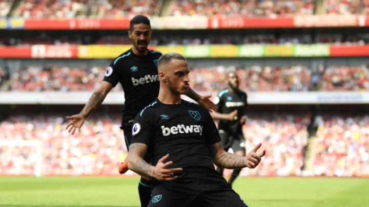 LONDON, ENGLAND - APRIL 22: Marko Arnautovic of West Ham United celebrates scoring his side's first goal with Manuel Lanzini during the Premier League match between Arsenal and West Ham United at Emirates Stadium on April 22, 2018 in London, England. (Photo by Mike Hewitt/Getty Images)