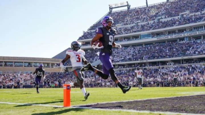 Oct 25, 2014; Fort Worth, TX, USA; TCU Horned Frogs wide receiver Josh Doctson (9) scores a touchdown during the first quarter against Texas Tech Red Raiders defensive back J.J. Gaines (3) at Amon G. Carter Stadium. Mandatory Credit: Kevin Jairaj-USA TODAY Sports