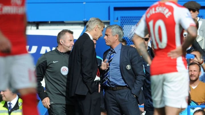 LONDON, ENGLAND - OCTOBER 05: Arsene Wenger the Arsenal Manager clashes chats with Jose Mourinho the Manager of Chelsea during the Barclays Premier League match between Chelsea and Arsenal at Stamford Bridge on October 5, 2014 in London, England. (Photo by David Price/Arsenal FC via Getty Images)