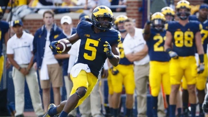 Sep 17, 2016; Ann Arbor, MI, USA; Michigan Wolverines linebacker Jabrill Peppers (5) runs the ball in the second quarter against the Colorado Buffaloes at Michigan Stadium. Mandatory Credit: Rick Osentoski-USA TODAY Sports