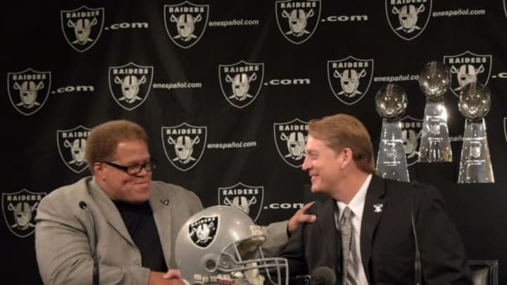 Jan 16, 2015; Alameda, CA, USA; Jack Del Rio (right) shakes hands with Oakland Raiders general manager Reggie McKenzie at press conference to announce his hiring as Raiders head coach at the Raiders practice facility. Mandatory Credit: Kirby Lee-USA TODAY Sports
