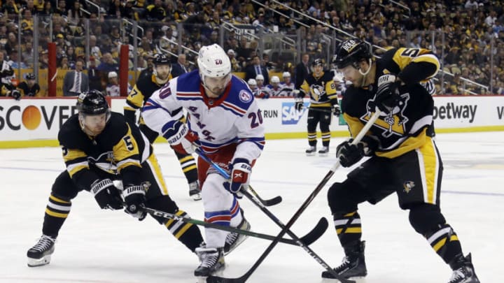 May 9, 2022; Pittsburgh, Pennsylvania, USA; Pittsburgh Penguins defenseman Mike Matheson (5) and Pittsburgh Penguins defenseman Kris Letang (58) defend New York Rangers left wing Chris Kreider (20) during the third period in game four of the first round of the 2022 Stanley Cup Playoffs at PPG Paints Arena. The Penguins won 7-2. Mandatory Credit: Charles LeClaire-USA TODAY Sports