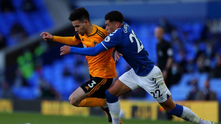 LIVERPOOL, ENGLAND - MAY 19: Rayan Ait-Nouri of Wolverhampton Wanderers battles for possession with Ben Godfrey of Everton during the Premier League match between Everton and Wolverhampton Wanderers at Goodison Park on May 19, 2021 in Liverpool, England. A limited number of fans will be allowed into Premier League stadiums as Coronavirus restrictions begin to ease in the UK. (Photo by Peter Byrne - Pool/Getty Images)