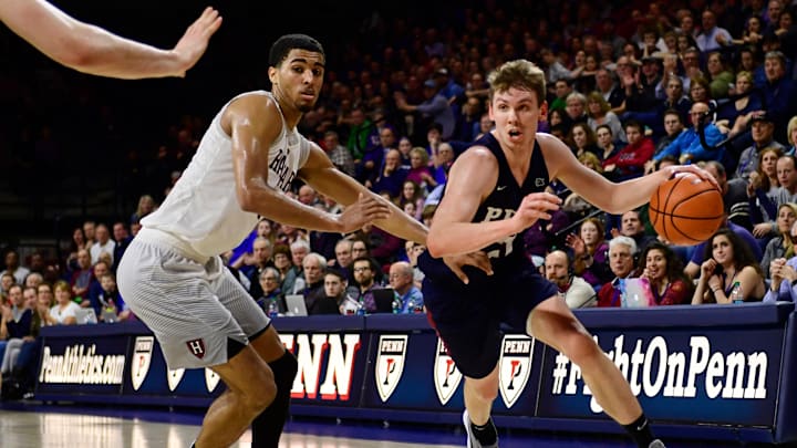 PHILADELPHIA, PA – FEBRUARY 24: Ryan Betley #21 of the Pennsylvania Quakers drives to the basket against Seth Towns #31 of the Harvard Crimson during the second half at The Palestra on February 24, 2018 in Philadelphia, Pennsylvania. Penn defeated Harvard 74-71. (Photo by Corey Perrine/Getty Images)